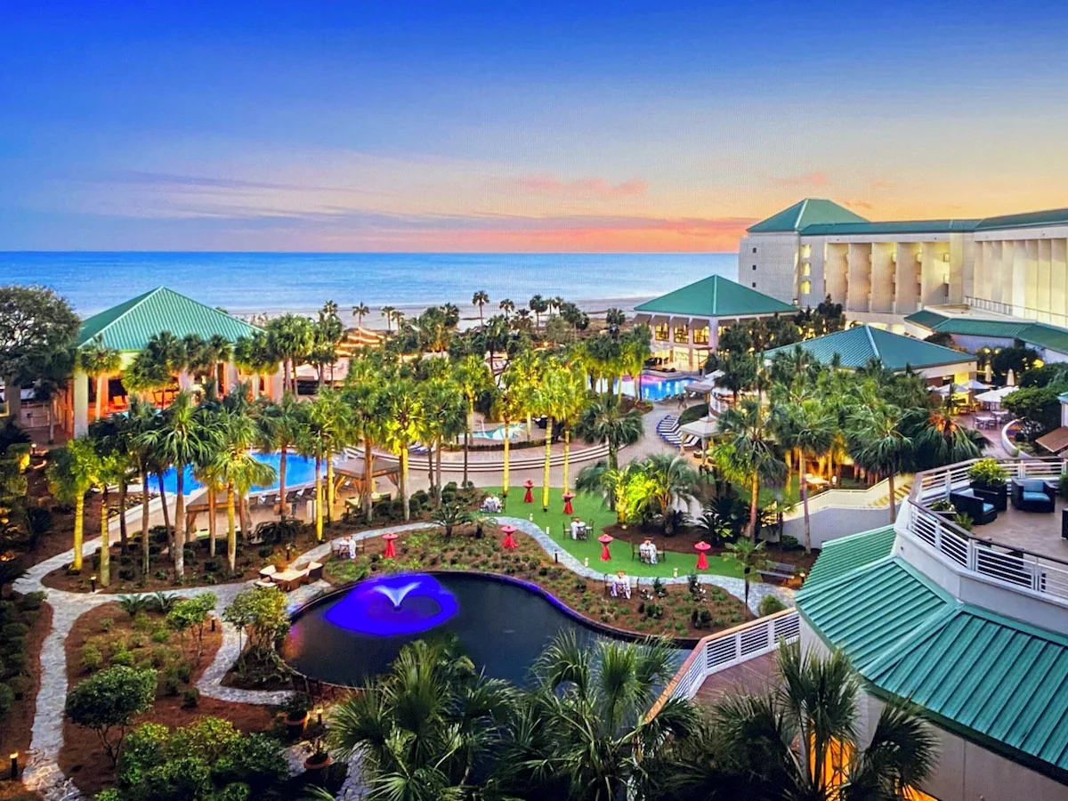 The resort grounds at sunset, with the ocean beyond