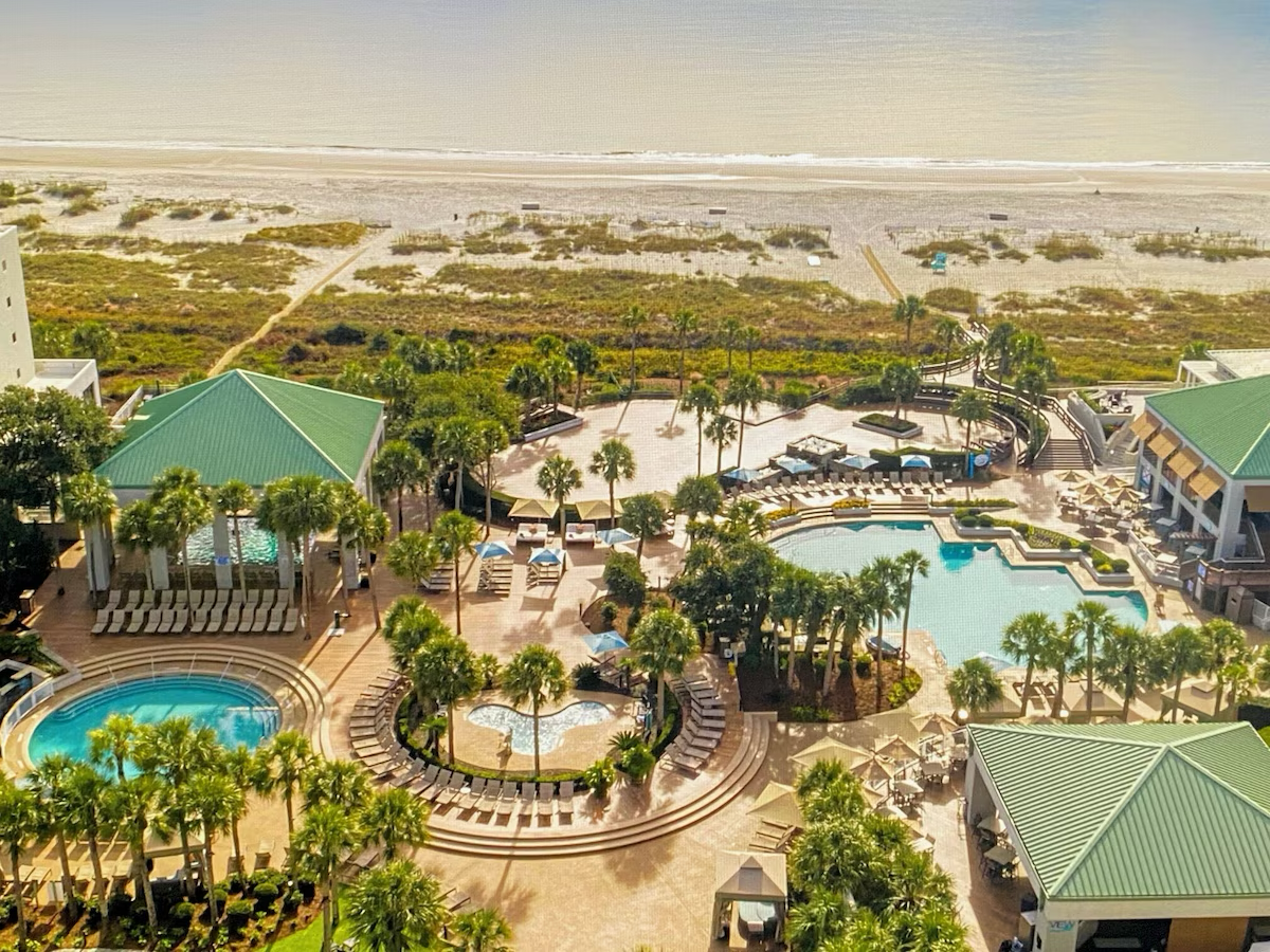 The pool complex from above, with the dunes beyond